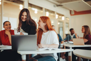 Higher ed woman studying together at computer