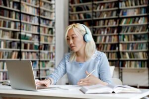 woman at laptop in a library