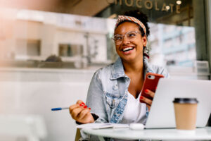 woman working at laptop in a cafe