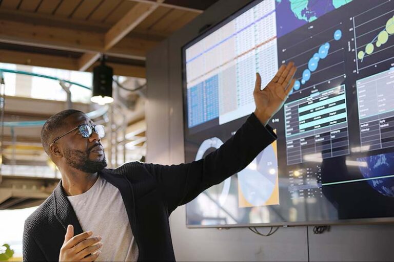 man presenting graphs