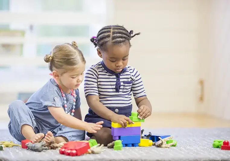 EDICS kids two pre-K toddlers playing with blocks