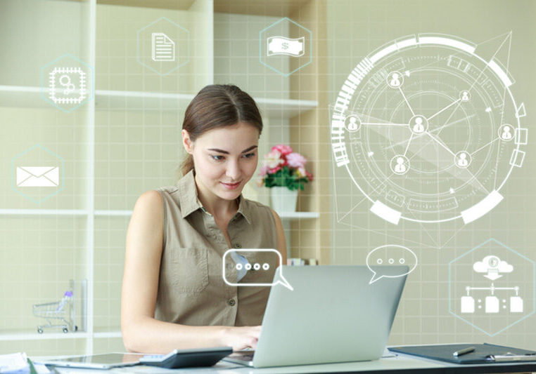 woman working at laptop with digital overlay