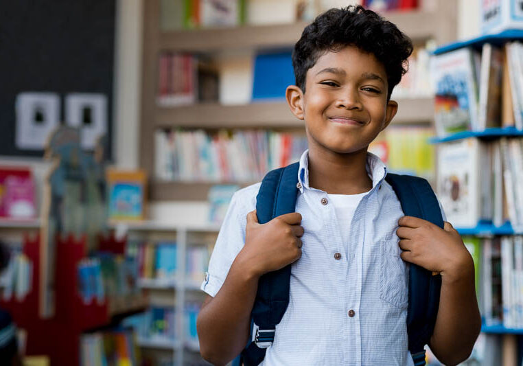 young-student-smiling-in-classroom-800x533 young student smiling at camera in classroom